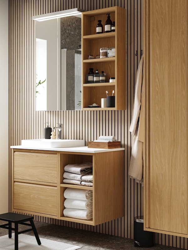 ÄNGSJÖN floating sink cabinet with 2 drawers in a modern small bathroom.