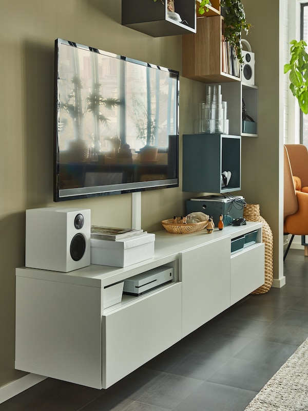 An IKEA BESTÄ tv unit in white in a sunny living room