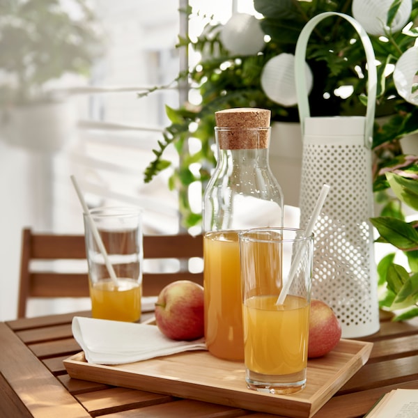 IKEA GODIS on a wooden tray with a matching jug filled with juice