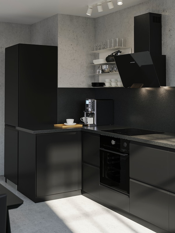 VOXTORP grey modern kitchen with black FINSMAKARE oven and extractor hood.