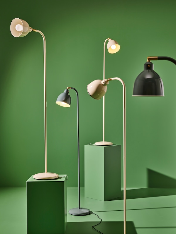 Multiple RÖDFLIK reading lamps on green background